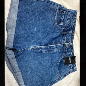 Slant pocket rolled hem denim shorts